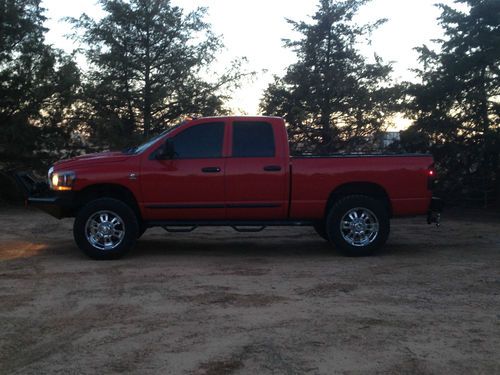 Red dodge 2500 cummins, smarty, exhaust, four door, 4x4, four wheel drive. 5.9l