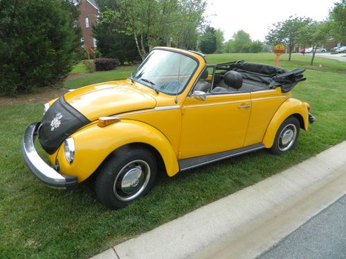 1978 vw karmann, super beatle convertible. yellow with black interior