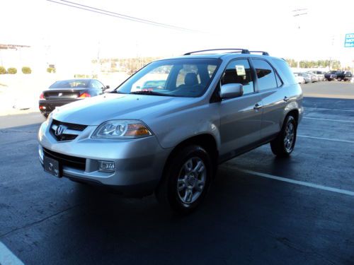 2006 acura mdx touring with navigation, back up camera 7 passang. mint!