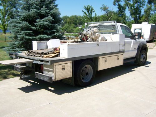 2006 f450 diesle only 17225 mi. flatbed boxes