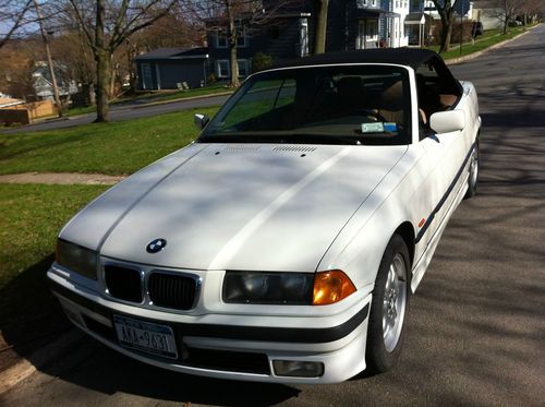 White/black with tan leather. 65,500 original miles.