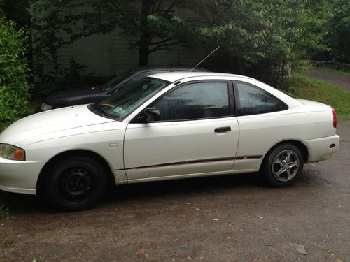 2000 white mitsubishi mirage, 38k miles. no rust, good engine.