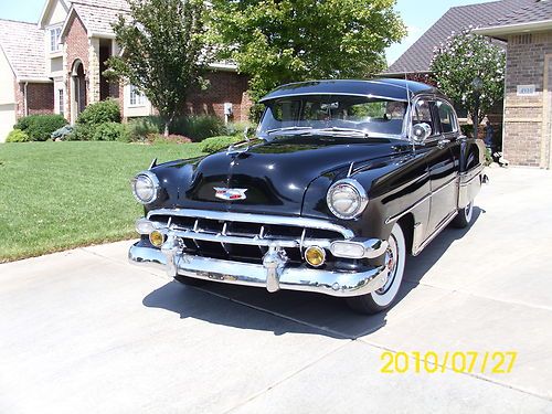 Beautiful show winning black bel air 4 door sedan loaded with chrome