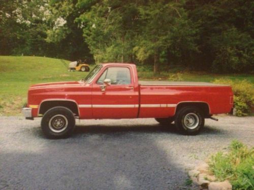 1981 red chevrolet chevy pick-up truck