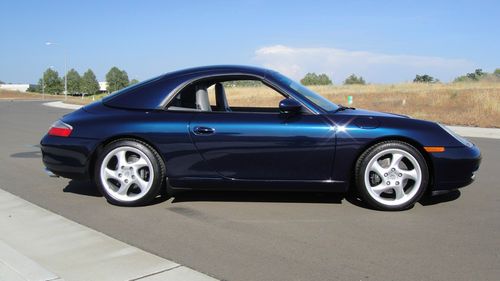 Blue, with grey leather. hard top / soft top