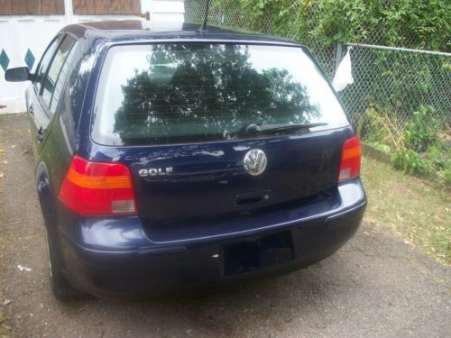 2003 vw golf, 4 cylinder, dark blue color like new, ac/heat works good. manual t