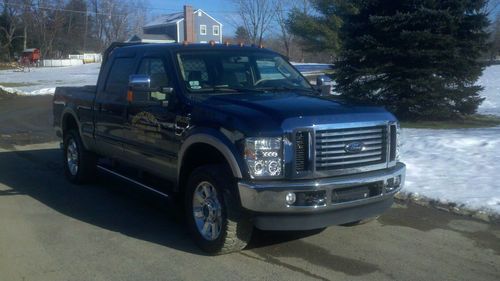 09 f350 fully loaded lariat. very clean truck dark blue w/gold two tone