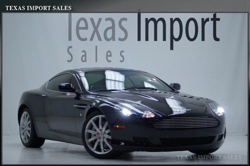 05 db9 8k miles sport shift,black/black,we finance