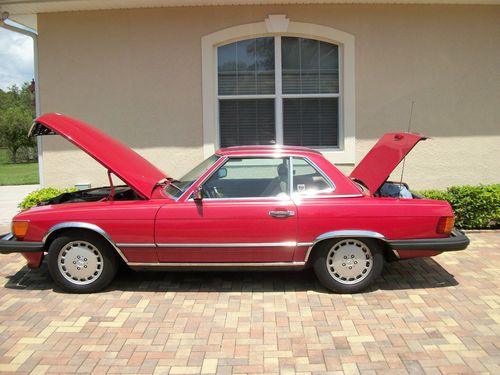 1988 red convertible 560 sl mercedes benz w/ palomino interior excellent cond.