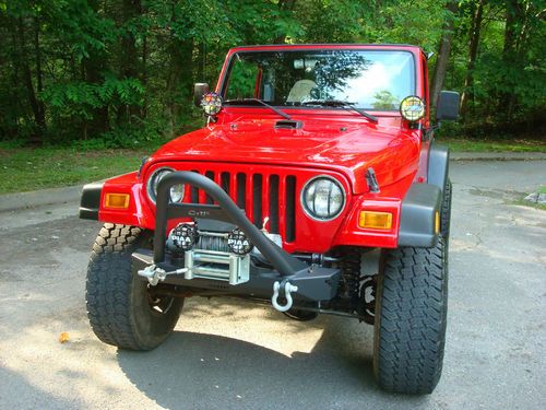 2001 jeep wrangler tj 4" lift 35's babied and loaded.  3 tops 4x4 manual 4.0