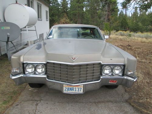 1969 cadillac coupe deville, runs well, drives. yet needs going through.