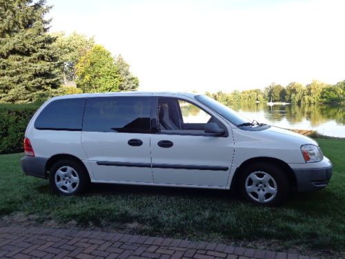 5 dr. white cargo van / metal divider. auto, ac, am/fm,pw, excellent condition