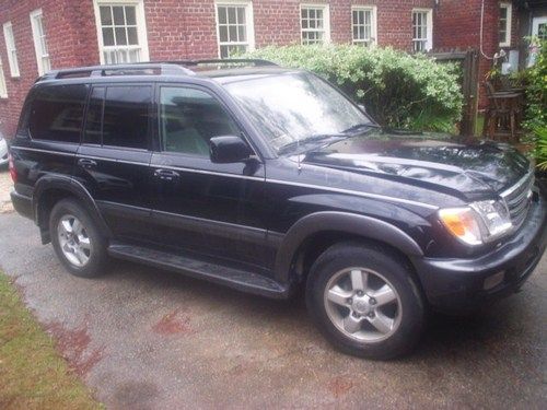 '04 toyota landcruiser w/navigation back-up 3rd row leather crunched front as is