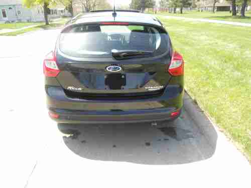 2012 FORD FOCUS TITANIUM HATCHBACK 2.OL/NO RESERVE/5 SPEED/NAVI/HTD LTHR/SUNROOF, image 2