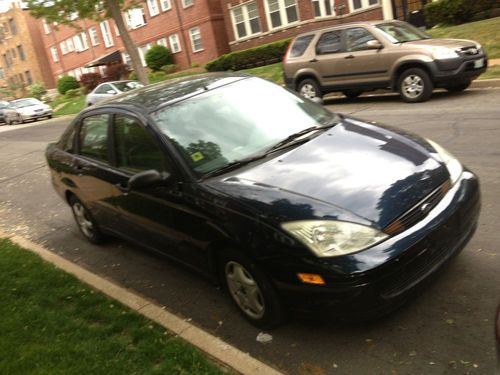 Ford focus 2002 dark blue sedan, refurbished engine, good tires, ac, clean