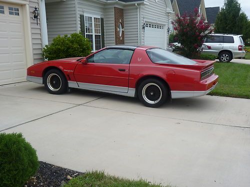 1988 pontiac fire bird trans am. red with grey interior very good condition.