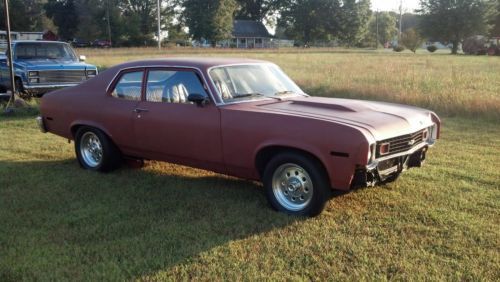 1974 spirit of america hatchback,red,black int.,bucket seats,factory floor shift