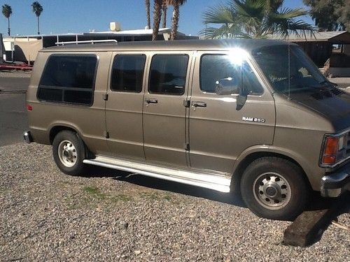 7 passenger van. driftwood gold color. fold down rear seat. camping, towing.