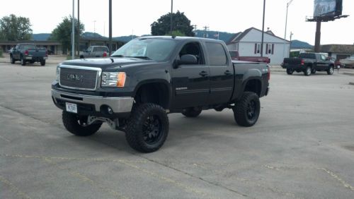 Metalic black 2010 gmc sierra 6.2 litre lifted 10 inches 35 inch tires