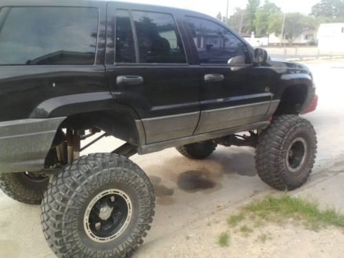 Huge lifted 2004 grand cherokee 38.5 crawlers, big lift