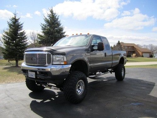 2003 ford f250 lariat super duty lifted 8"  67k mi