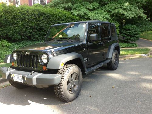 2012 jeep wrangler unlimited sport 4 door/ 9,000 miles hard top and soft top