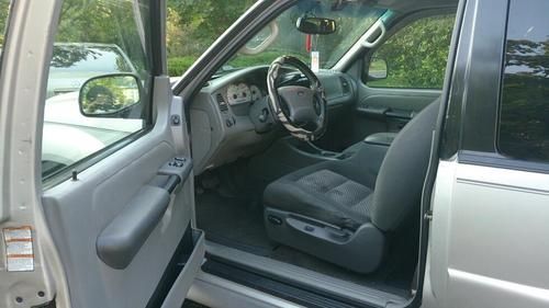 Silver 2003 ford explorer sport xlt, in fair shape. gray interior.