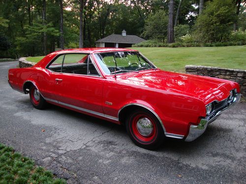 1967 olds 442 survivor car,factory red car ,black bucket seats,78,000 miles
