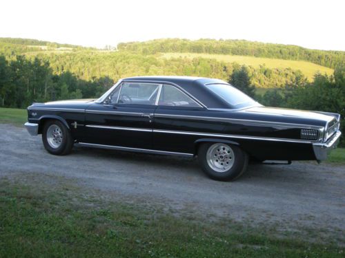 Rare -  black fastback with red interior, 390 v8 automatic with weld wheels