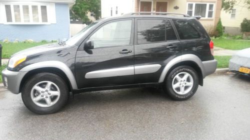 2001 toyota rav4l, black color with a silver stripe