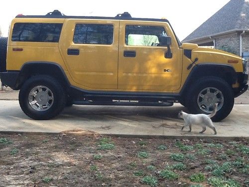 Hummer h2 2003 yellow 4 door, very low miles, awd, dual tv's,