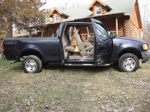 No rust runs good 5 speed! xlt loaded 4x4 v8-4.6 triton quad cab!!!