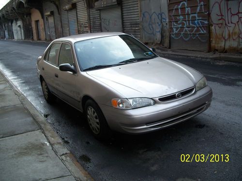 1999 corolla 4dr tan/tan cloth auto 122k runs nice gas saver