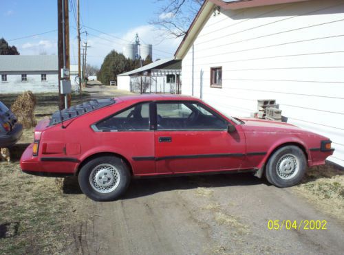 1984 celica supra, red w/grey interior. parts car w/clean title