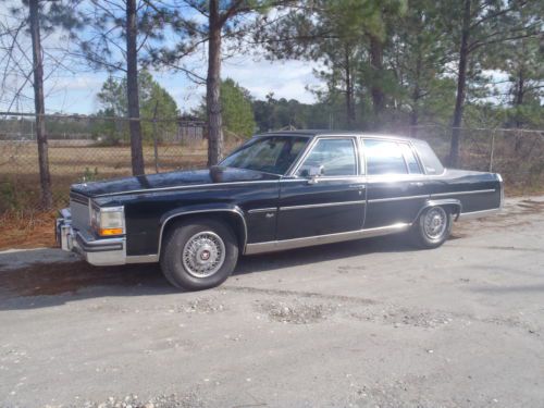 Black 4 door fleetwood  d elegance