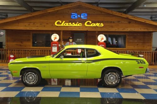 1975 plymouth duster with a 340 6 pack 3x2 carbs setup