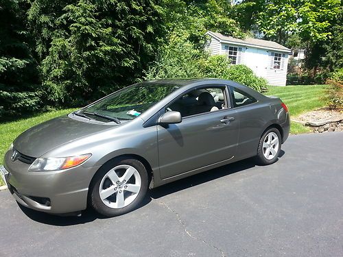 2 door coupe, 65,000 miles, original owner, well maintained, grey/brown,