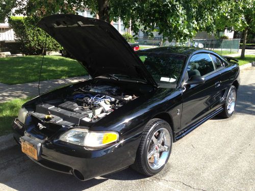 1997 mustang cobra , black, 53,000, cloth seats, mach stereo.