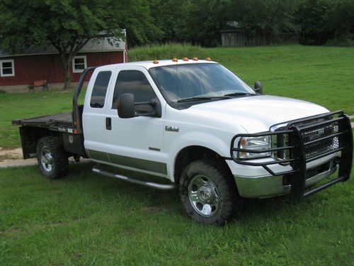 2005 ford f350 4wd flat bed truck with hydra bed hay bale handler