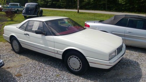 1987 cadillac pearl white an red interior convertible!! power everything! a/c.