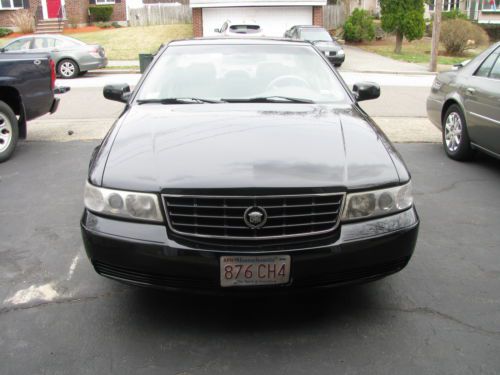 Beautiful black 1998 sts caddy 4 doors  only 90,000 miles.