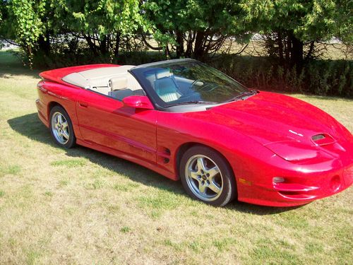 Red convertible, taupe leather, mint