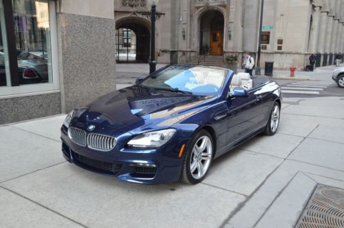 2013 bmw 650i convertible.  deep sea blue with ivory white.