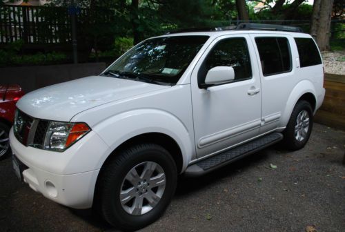 White with beige leather, 8 passenger, 115,000 miles...mint condition