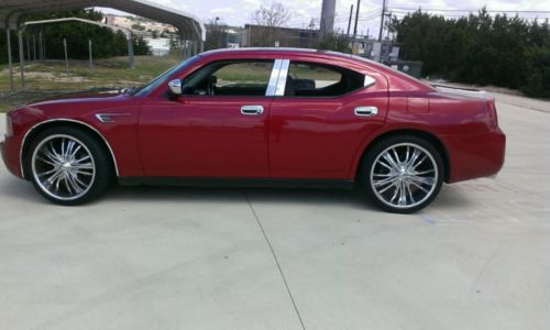 Red dodge charger, rims. less then 100k mph