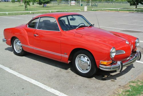 Red coupe, good condition, one owner, not without blemishes