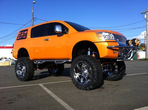 Custom lifted showtruck lambo orange nissan armada