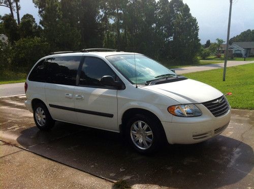 White 7 passenger mini van in great condition. low mileage!!