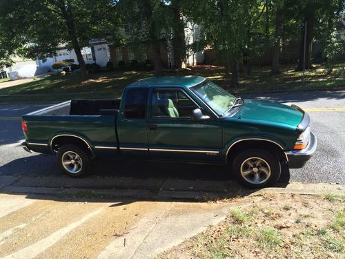 Green ls with lined truck bed