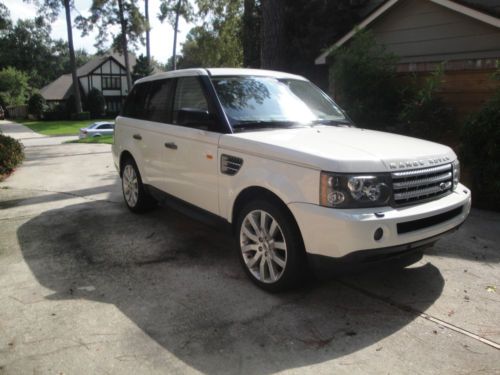 Supercharged built in video in headrests    white with white leather interior